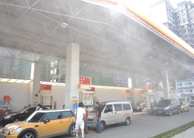 Gas station atomizing spray cooling
