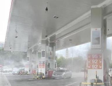 Gas station atomizing spray coo